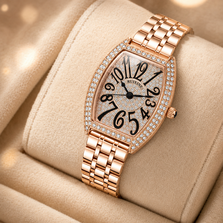 Relógio retangular dourado rosé com moldura cravejada, pulseira metálica e mostrador branco