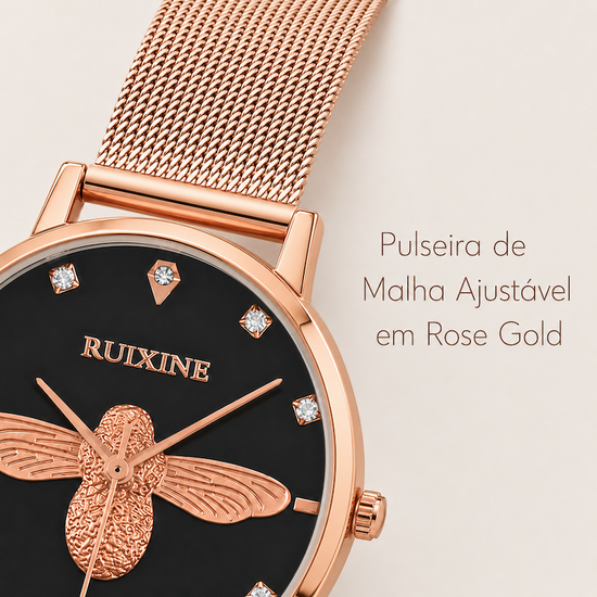 Relógio feminino rosé com mostrador preto e pulseira metálica; detalhe da abelha e marcadores