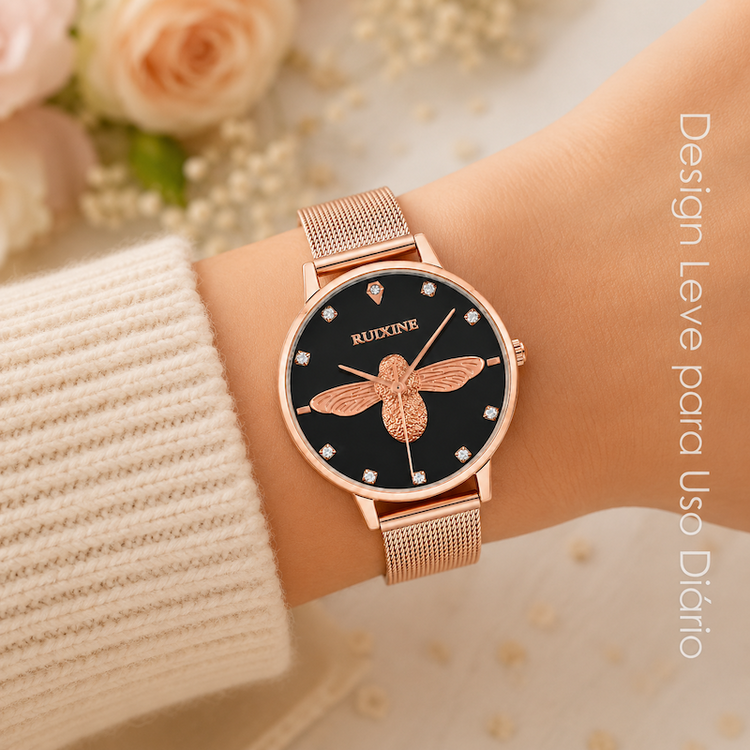 Relógio feminino rosé com mostrador preto e pulseira malha metálica, abelha dourada