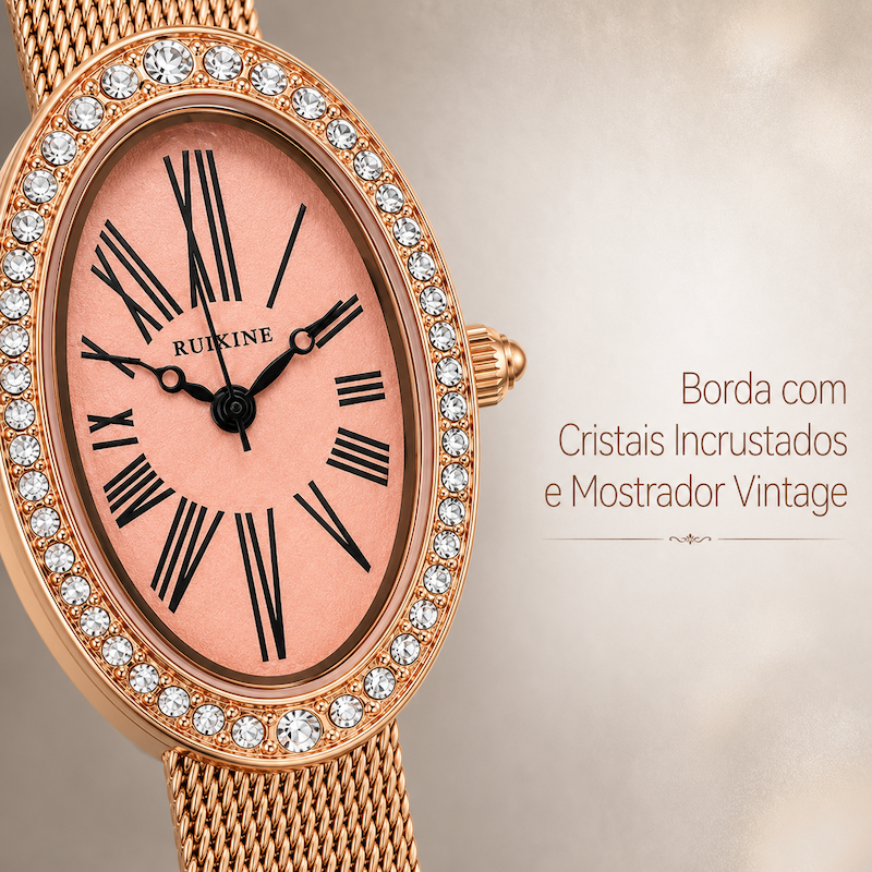 Close do relógio oval rosé gold: mostrador rosa e bezel com cristais sobre pulseira de malha