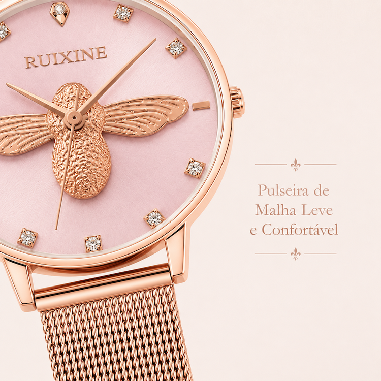 Relógio feminino com mostrador rosa, pulseira malha rosé e abelha dourada em destaque