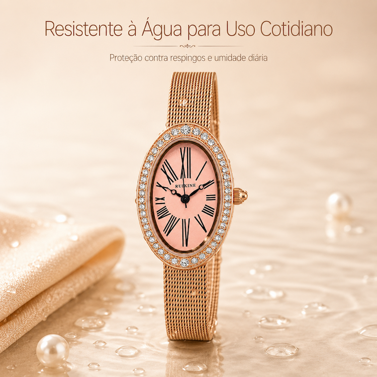 Relógio oval rosé gold com mostrador rosa, bezel cravejado e pulseira de malha metálica