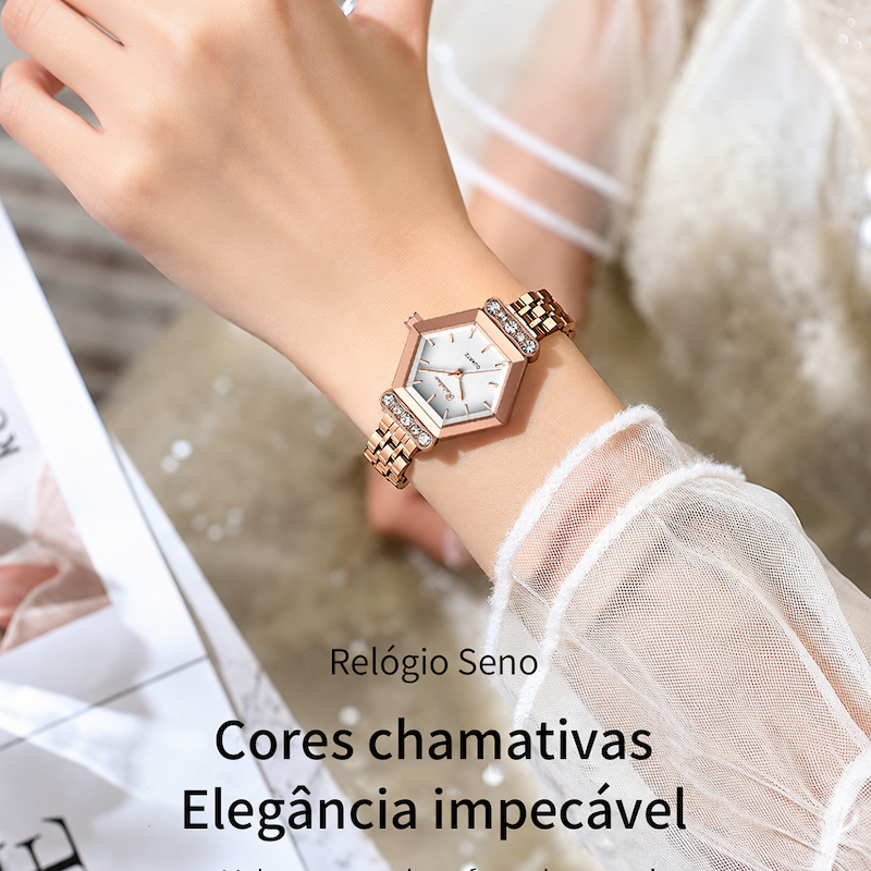 Relógio rosé no pulso, mostrador branco, caixa hexagonal e pulseira metálica