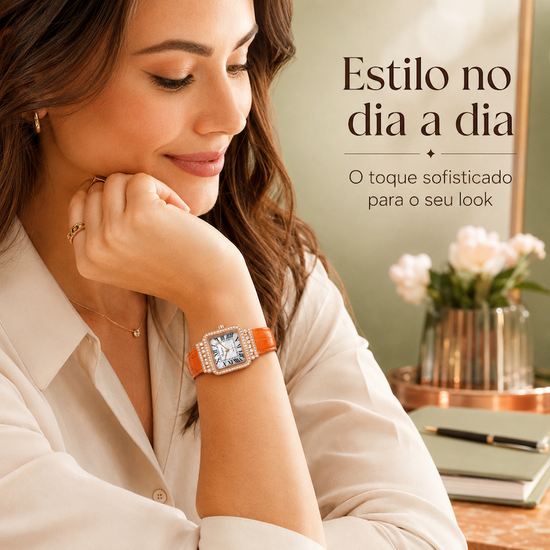 Relógio feminino laranja no pulso, visor quadrado e moldura dourada com cristais