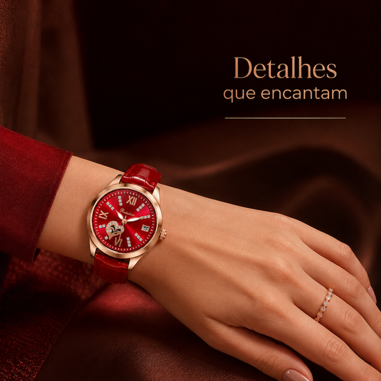 Relógio com mostrador vermelho, pulseira de couro vermelha e detalhes brilhantes