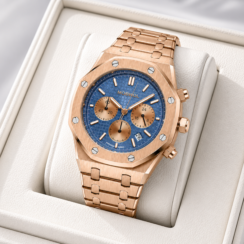 Relógio dourado rosé com mostrador azul, pulseira metálica, em estojo branco