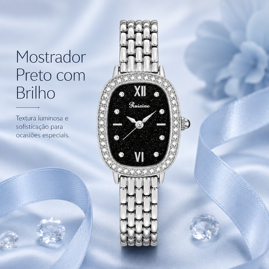 Relógio feminino prateado com mostrador preto, aro de strass e pulseira metálica