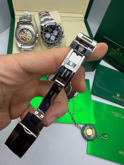 Relógio Daytona automático com fecho aberto e pulseira preta, caixa em aço